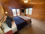 Upstairs Bedroom offers a King Bed, Flat Screen Tv and a small private porch 